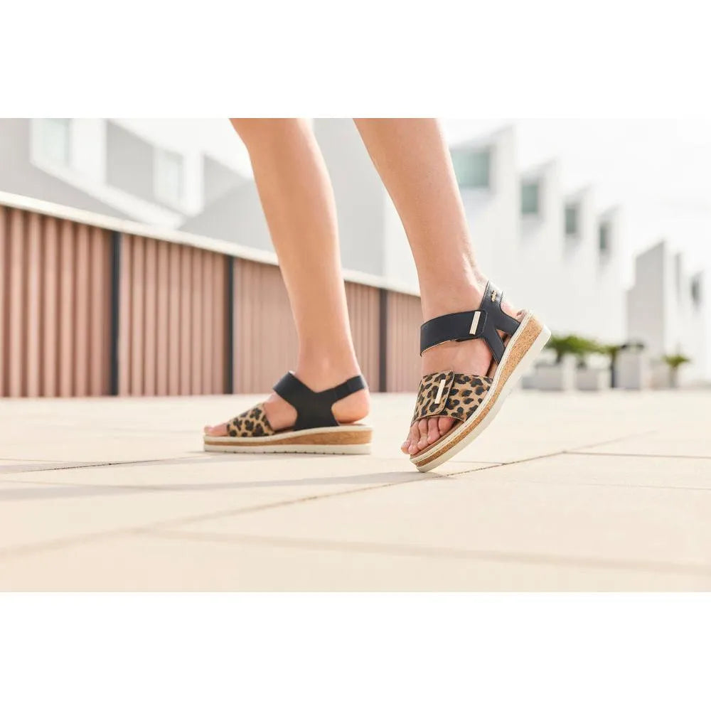 Rieker V4181-00 women's wide fit multi-touch fastening sandals with leopard print straps and cork soles.