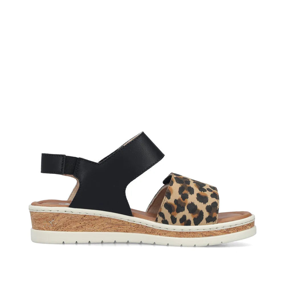 Rieker V4181-00 women's wide fit, multi-touch fastening sandal with leopard print strap and cork wedge sole.