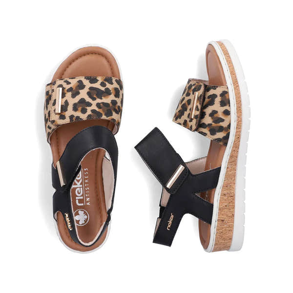 Rieker V4181-00 women's wide fit multi-touch fastening sandals with leopard print and black straps, cork heel, and white sole.