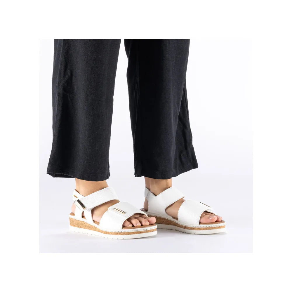 Rieker V4181-80 wide white touch fastening ladies' sandals with adjustable straps and cork midsole.