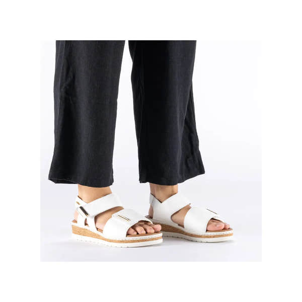Rieker V4181-80 wide white touch fastening ladies' sandals with adjustable straps and cork midsole.