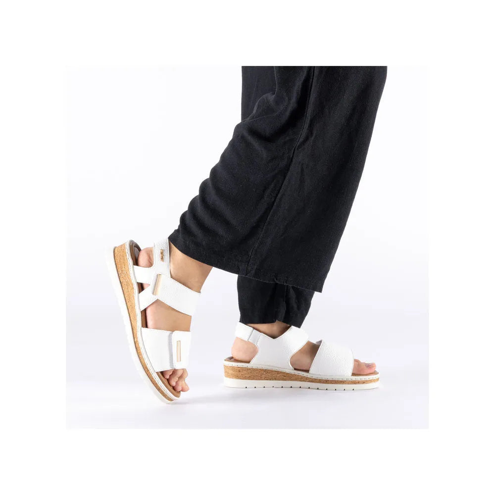 Rieker V4181-80 women's wide white touch fastening sandals with cork sole and adjustable straps.