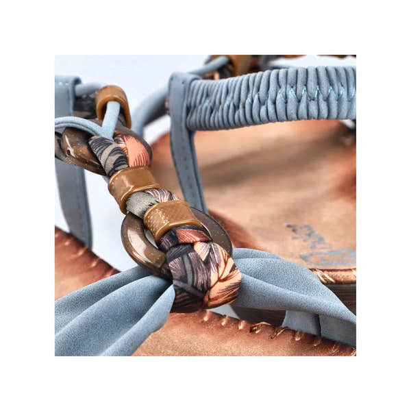 Rieker V7568-14 Ladies denim blue elasticated sandals with stylish braided strap and decorative buckle details.