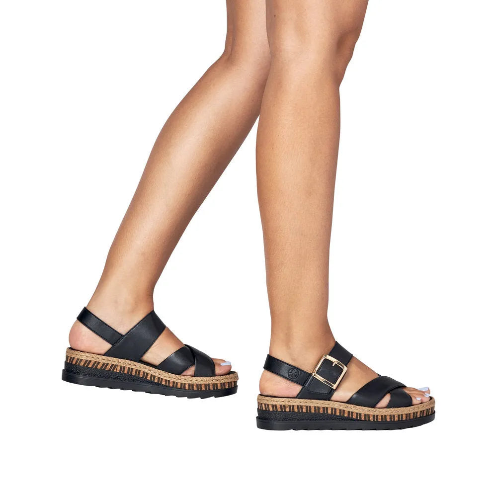 Rieker V7951-00 women's black leather touch fastening sandals with wedge sole and buckle strap detail.