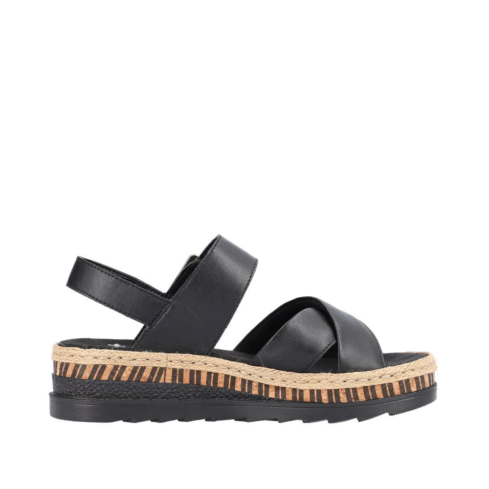 Rieker V7951-00 women's black leather touch fastening sandals with chunky sole and woven espadrille-style trim.