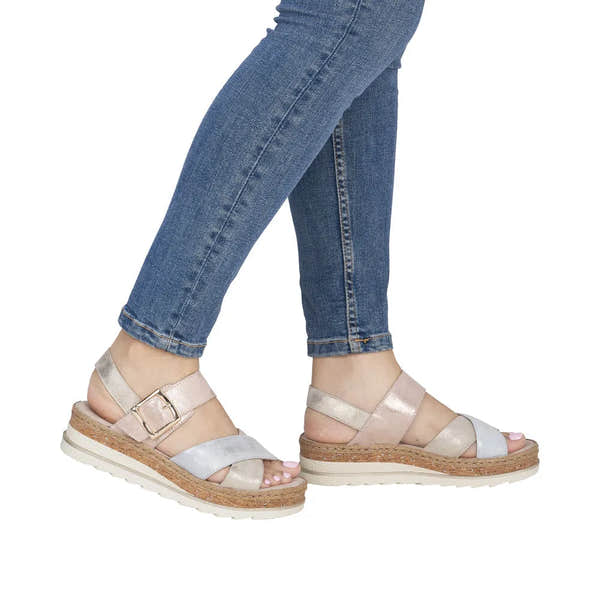 Rieker V7951-90 women's multi leather touch fastening sandals with cork and white sole, worn with blue jeans.
