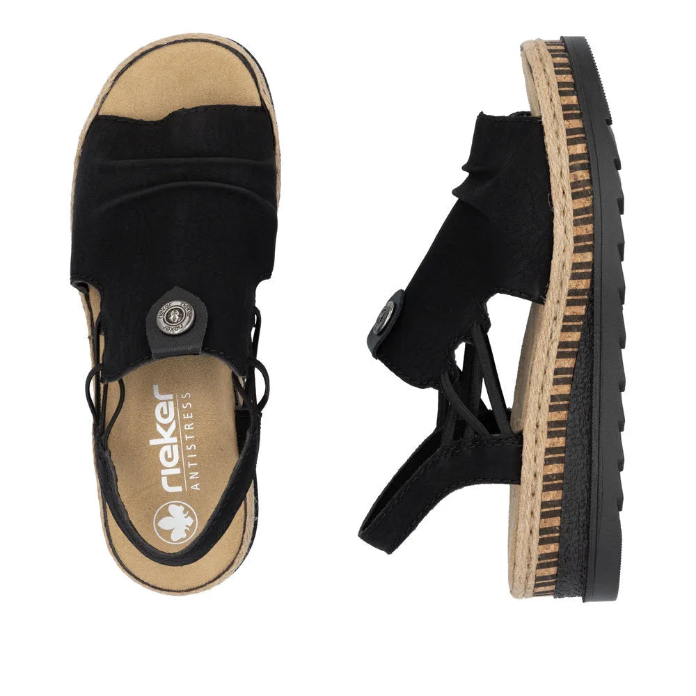 Rieker V7972-00 black pull-on sandals with fabric straps, cushioned insole, and a layered beige and black rubber sole.