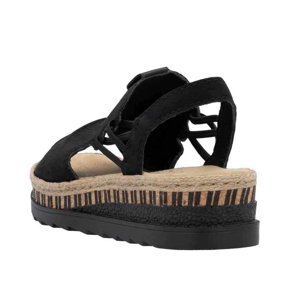 Black pull-on sandal with fabric straps, Espadrille-style platform sole, and a textured black outsole.