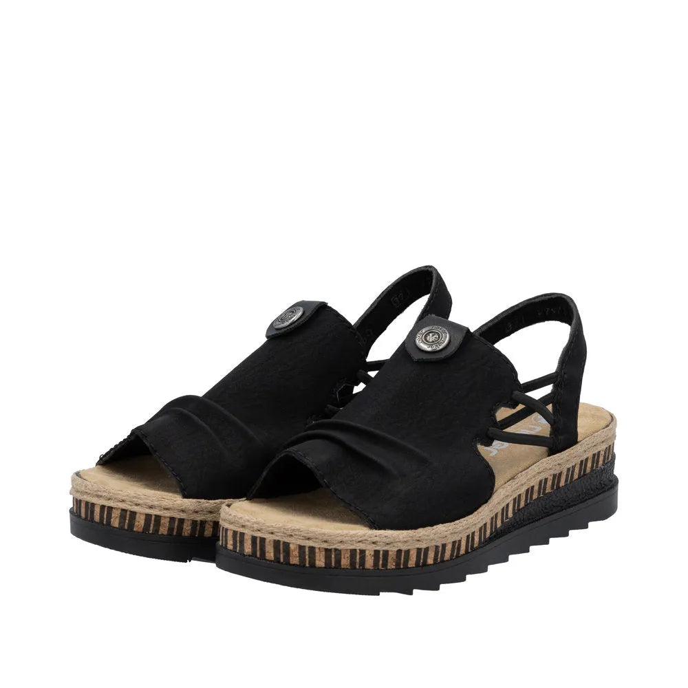 Black slip-on sandal with fabric upper, lace details, and a striped jute-wrapped platform sole.