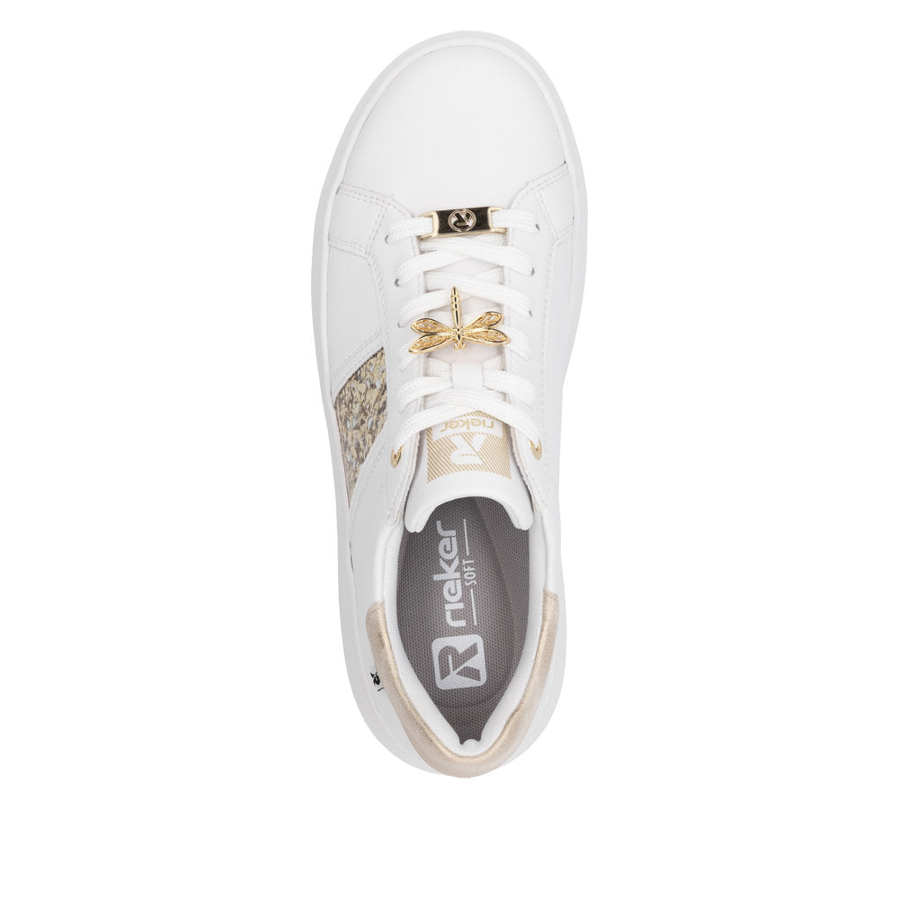 Rieker W1202-82 women's white leather lace-up trainers with metallic accents and decorative gold dragonfly charm.