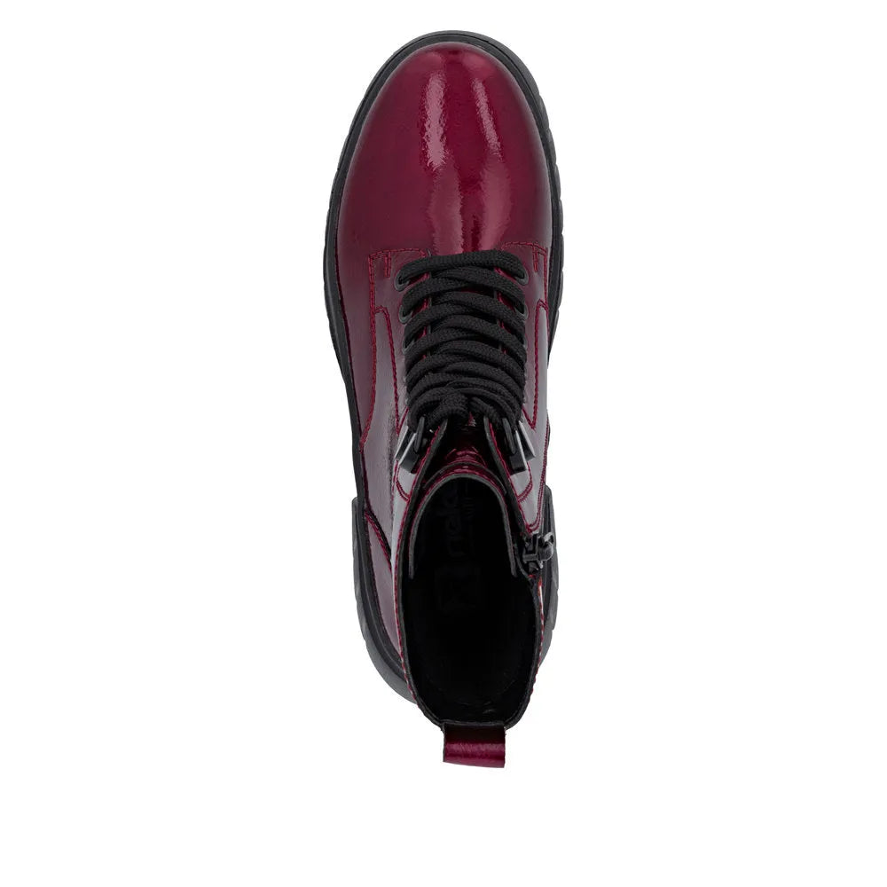 Rieker W1870-35 women's red patent leather ankle boots with lace-up and side zipper.