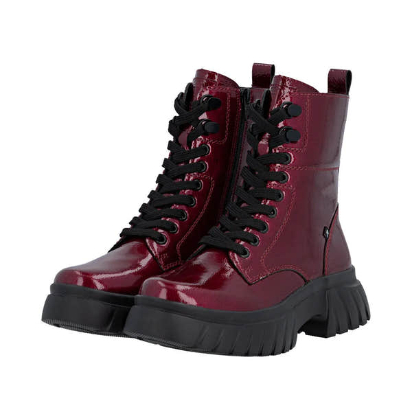Rieker W1870-35 women's red patent leather ankle boots with lace-up front and side zipper, chunky black sole, and pull tabs.