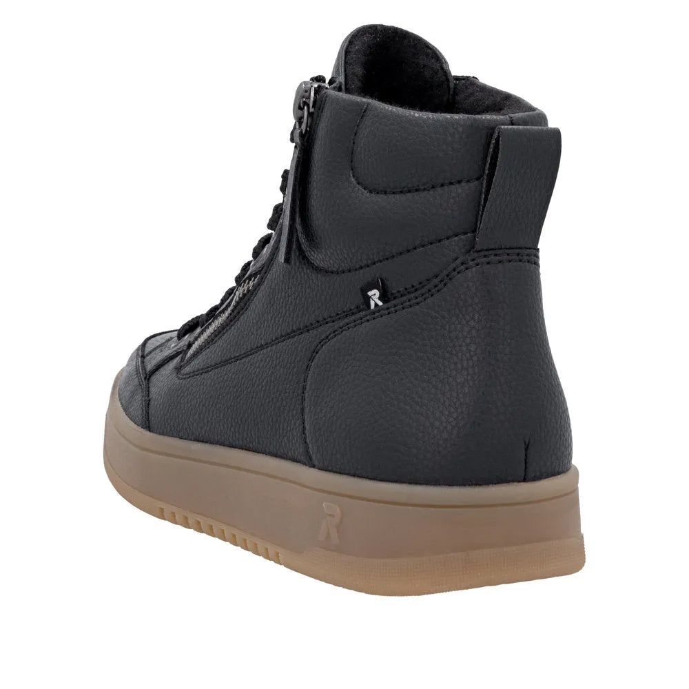 Rieker W1971-00 ladies black leather ankle boots with zip and lace-up detail, padded collar, and beige sole.