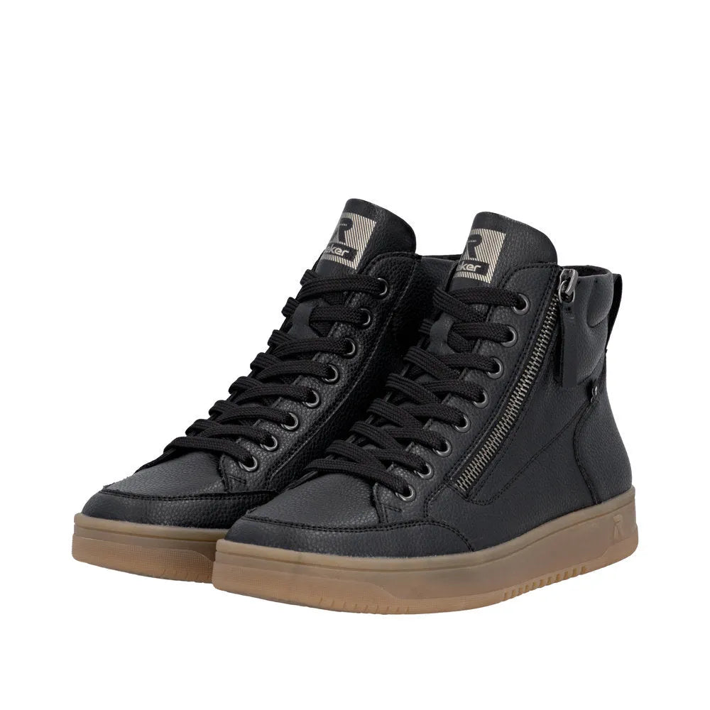Rieker W1971-00 women's black leather ankle boots with zipper and lace-up design, tan rubber sole, stylish and comfortable footwear.