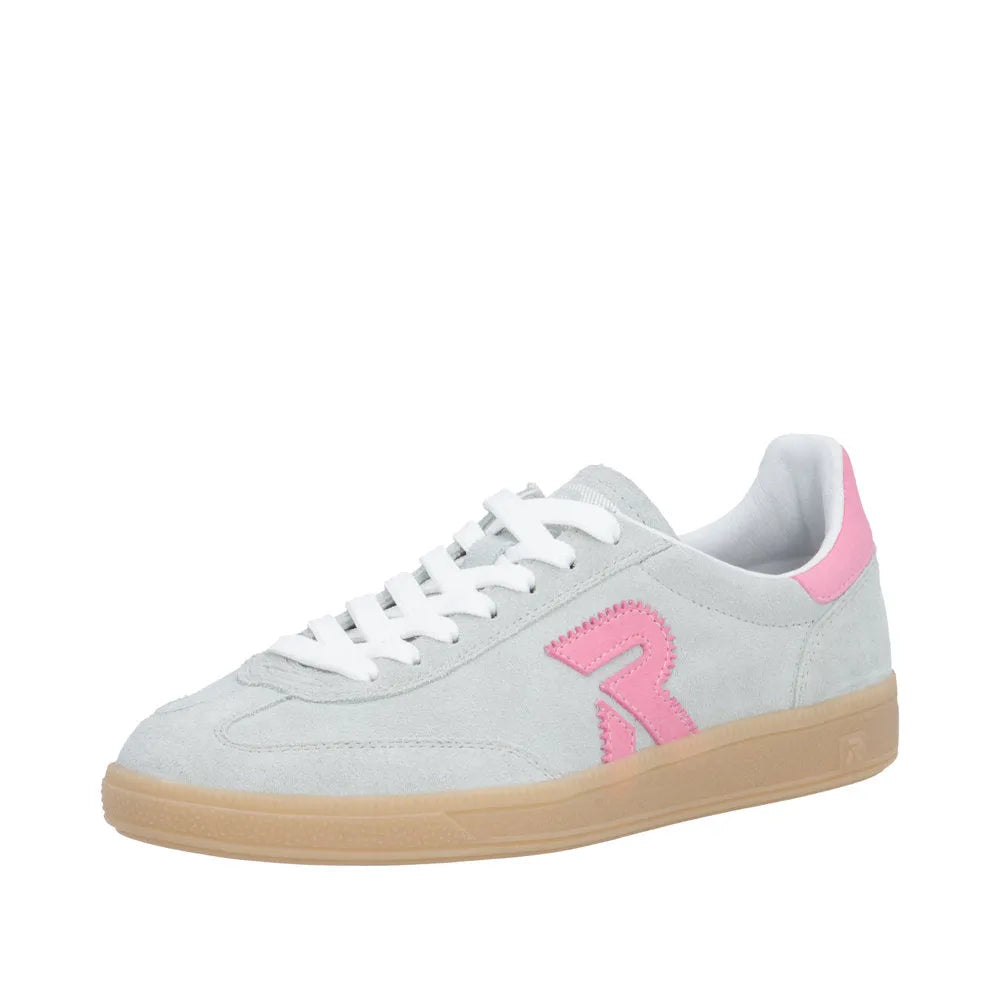 White suede lace-up trainers with pink logo and heel tab, cushioned interior, and tan rubber sole.