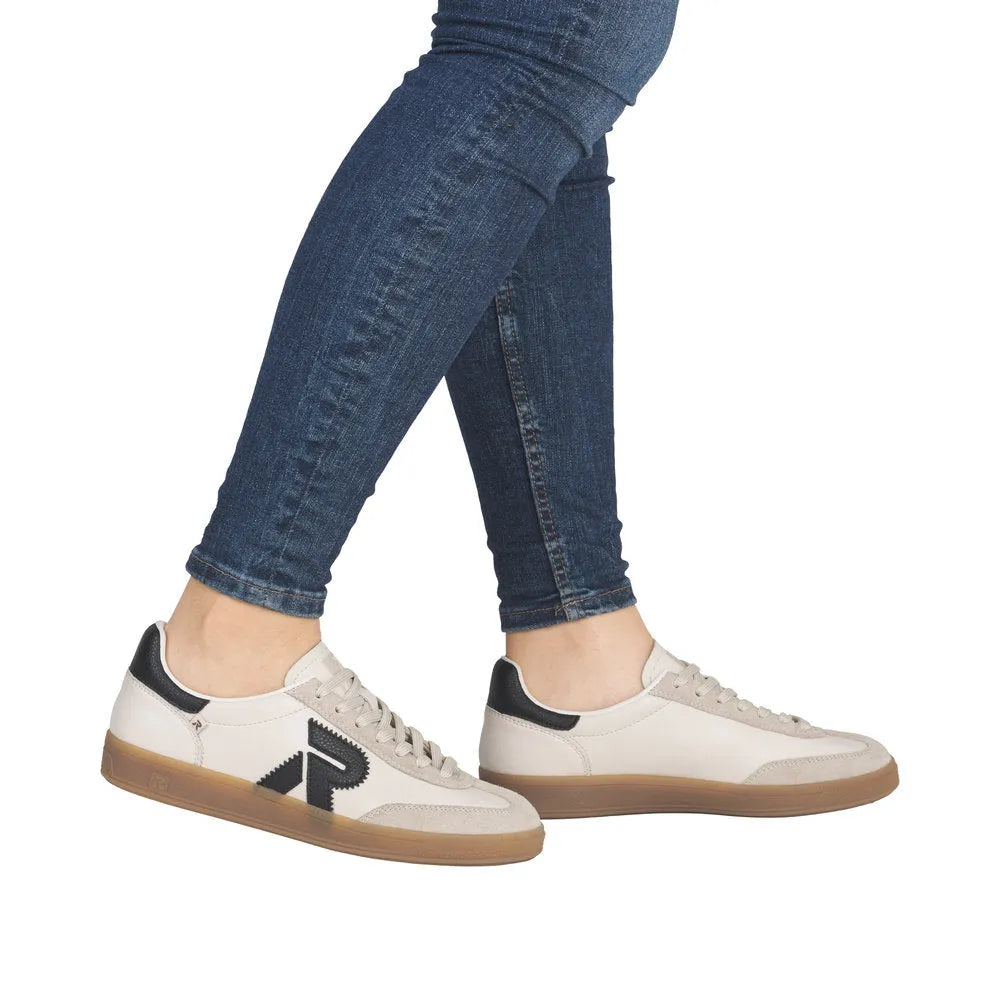 Rieker W2200-60 Ladies Wide Beige Suede Lace-Up Trainers, casual sneakers with black logo details and gum sole.