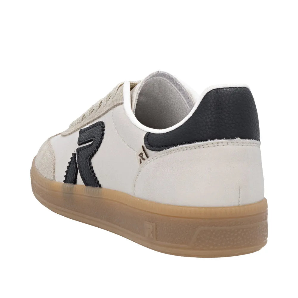 Rieker W2200-60 women's beige suede lace-up trainers with black heel detail and gum rubber sole.