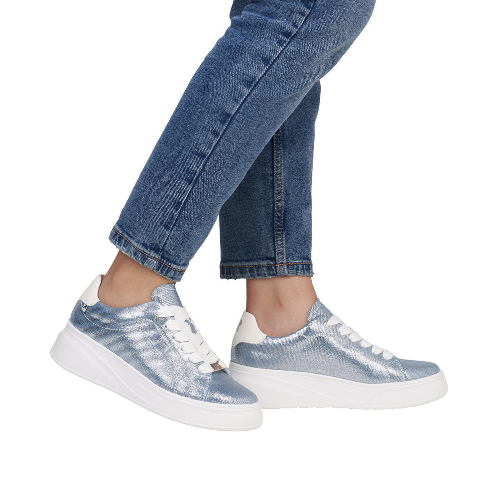 Rieker W2302-14 women's metallic lace-up trainers with denim textile accents and white chunky soles.
