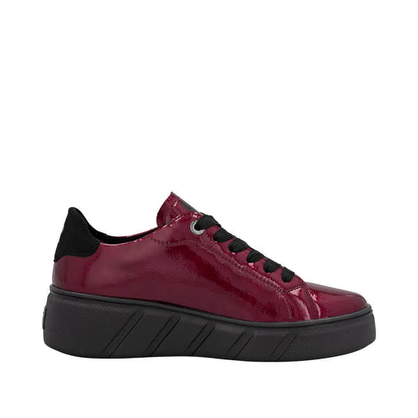 Rieker W2601-35 women's red patent leather lace-up trainers with black accents and chunky black sole.