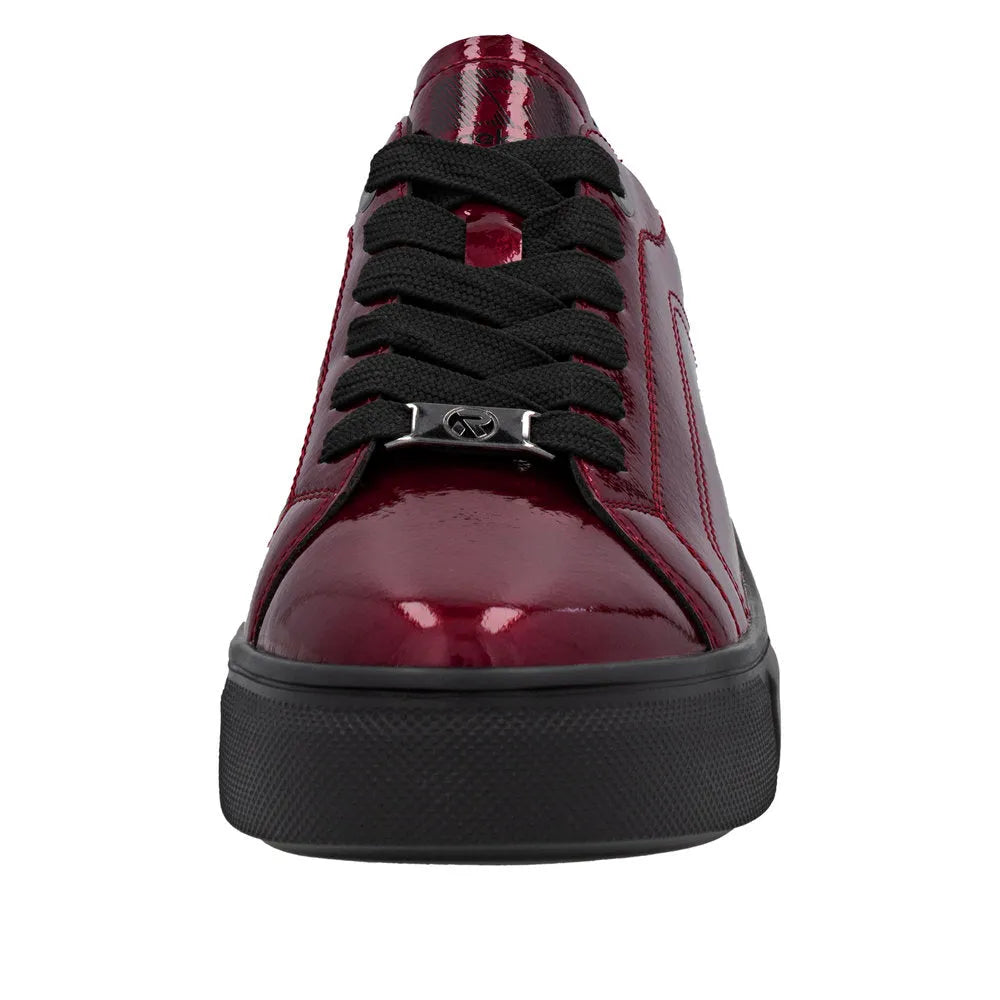 Rieker W2601-35 women's red patent leather lace-up trainers with black laces and chunky rubber sole.
