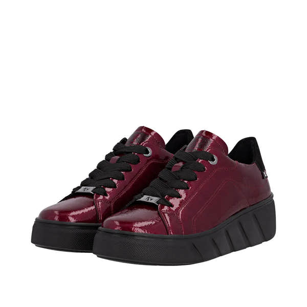 Rieker W2601-35 women's red patent leather lace-up trainers with chunky black soles and black laces.