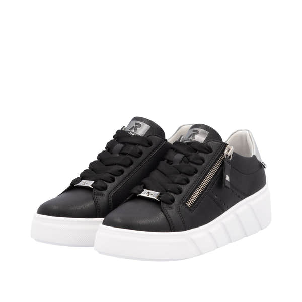 Rieker W2605-00 women's black leather sneakers with lace-up closure, side zipper, and chunky white sole.