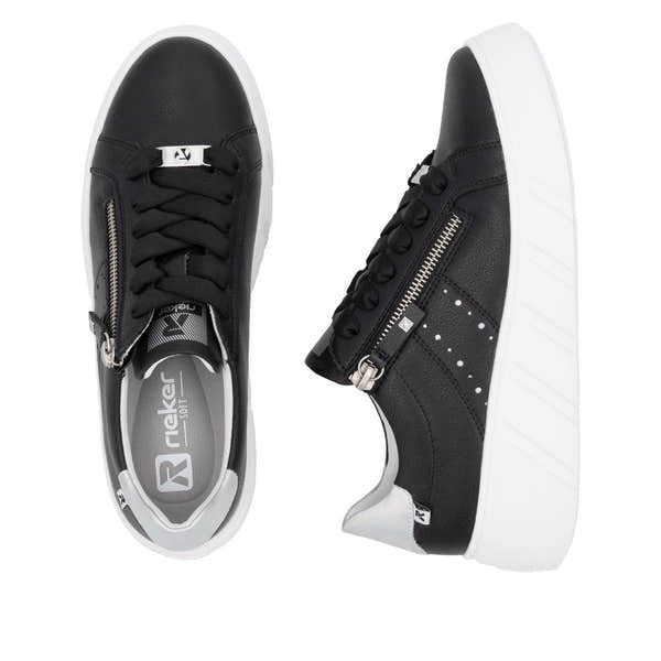 Rieker ladies' black leather sneakers with zip and lace-up closure, white sole, stylish design.
