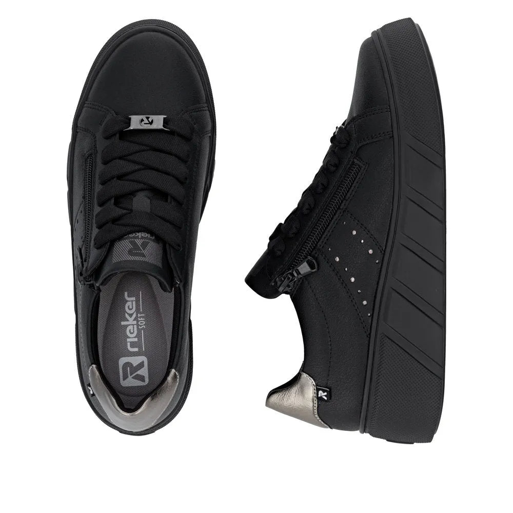 Black leather women's trainers with zip and lace closure, cushioned sole, and metallic accents, Rieker W2605-02.