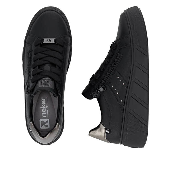 Black leather women's trainers with zip and lace closure, cushioned sole, and metallic accents, Rieker W2605-02.