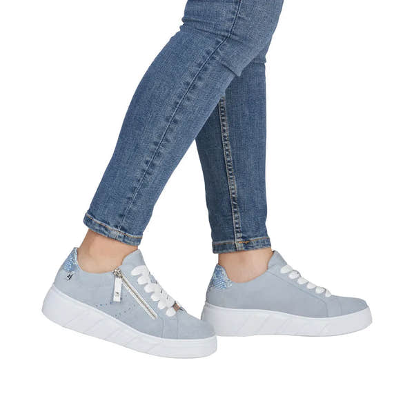 Light blue suede lace-up sneakers with side zippers, white soles, and decorative heel details.
