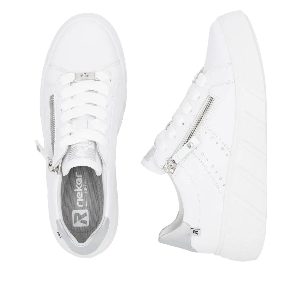 White leather Rieker W2605-80 women's sneaker with zip and lace-up closure, platform sole, and subtle metallic accents.