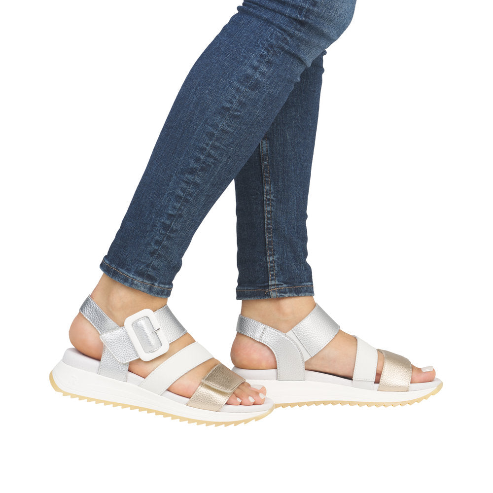 Rieker W2950-90 Ladies Gold/White Leather Touch Fastening Sandals with adjustable straps and chunky sole.