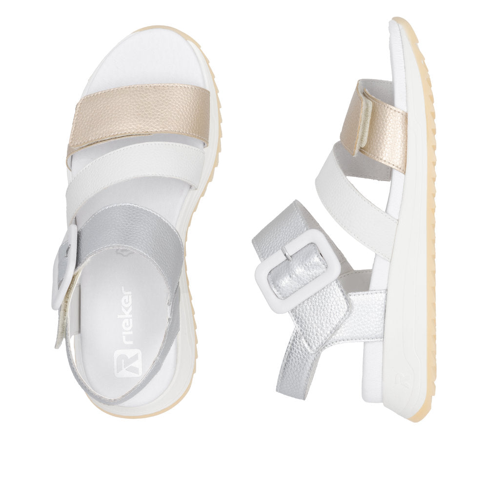 Rieker W2950-90 women's gold and white leather touch-fastening sandals with buckled straps and cushioned sole.