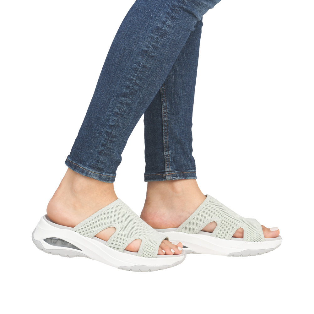 Rieker W3150-52 women’s green textile vegan slip-on mules with cushioned sole and air cushion detail.