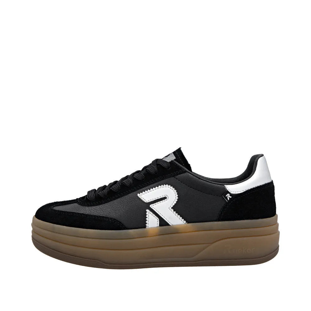Rieker W3700-00 women's black leather lace-up trainers with a chunky brown sole and white logo detail.