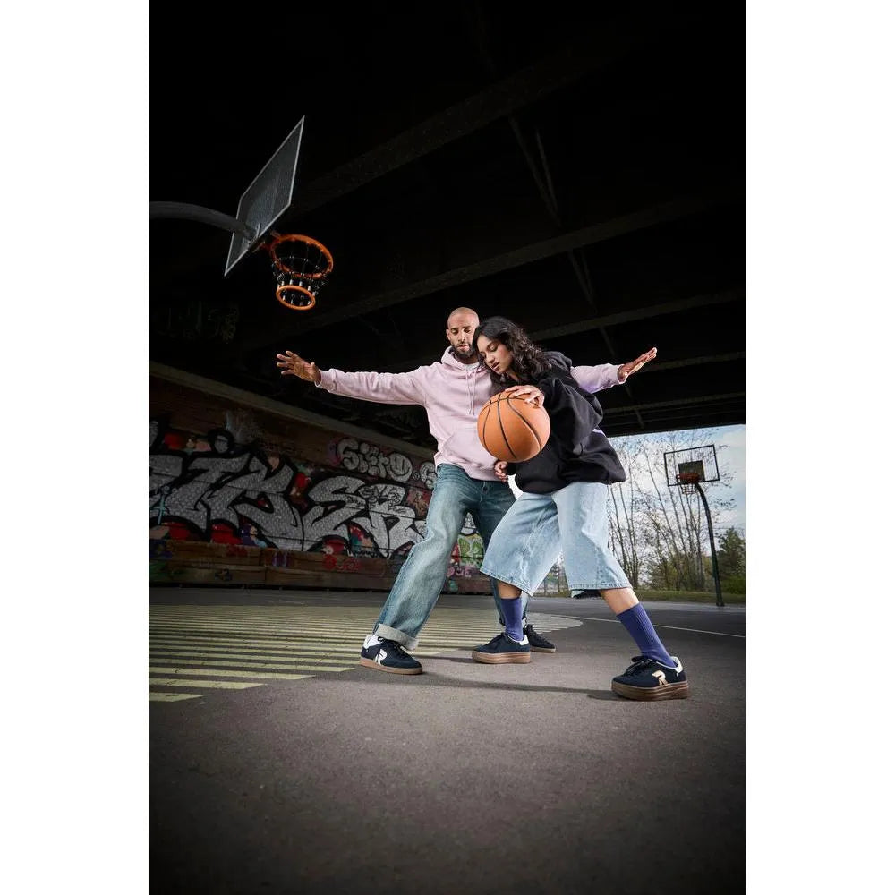 Rieker W3700-14 Ladies Blue Suede Lace-Up Trainers on basketball court with two players.