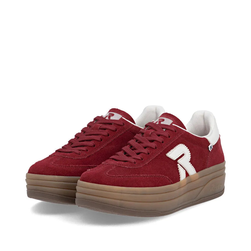 Rieker W3700-35 women's red suede lace-up trainers with chunky brown sole and white detailing.