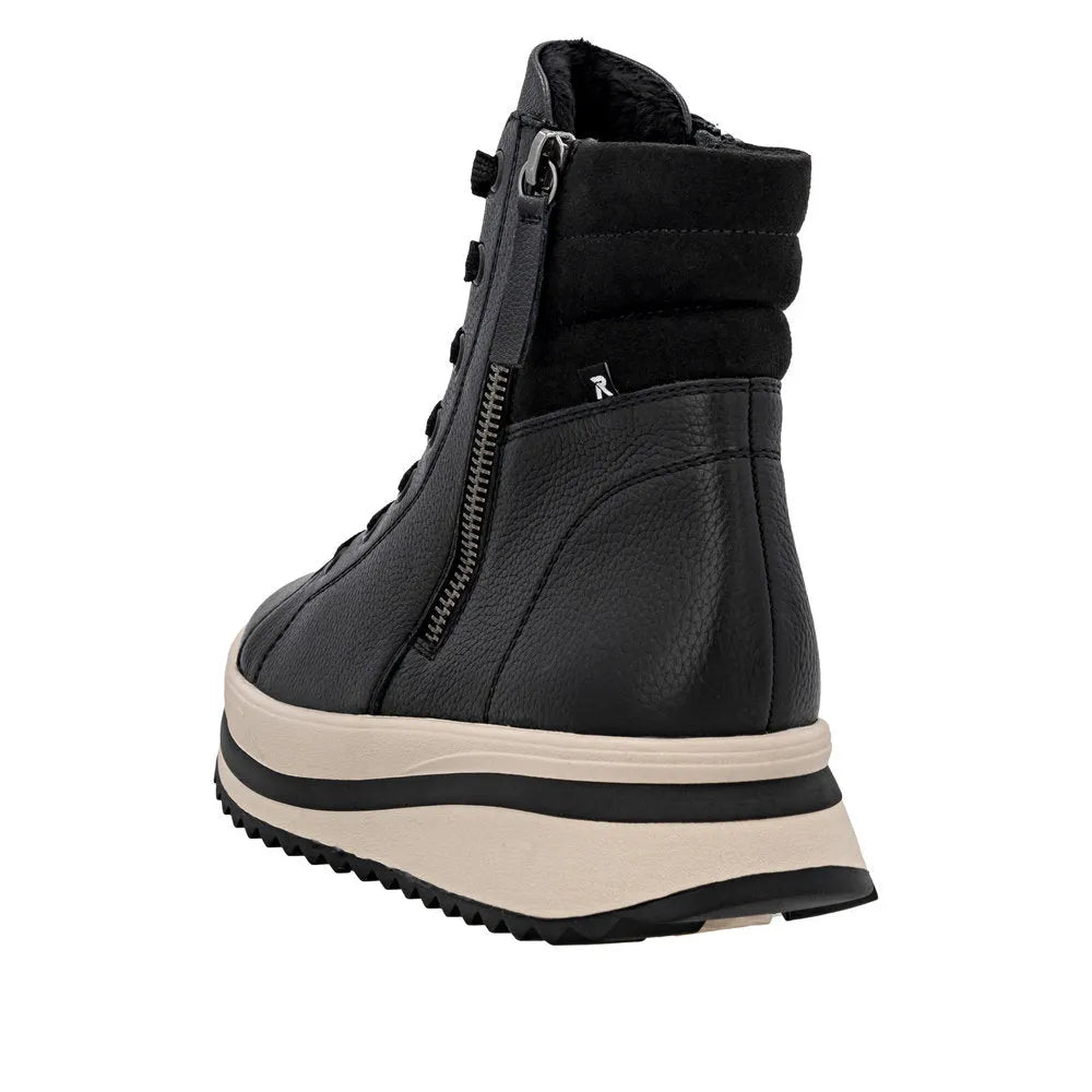Rieker W3870-00 women's black leather ankle boots with zip and lace closure, thick wedge sole, and padded ankle collar.