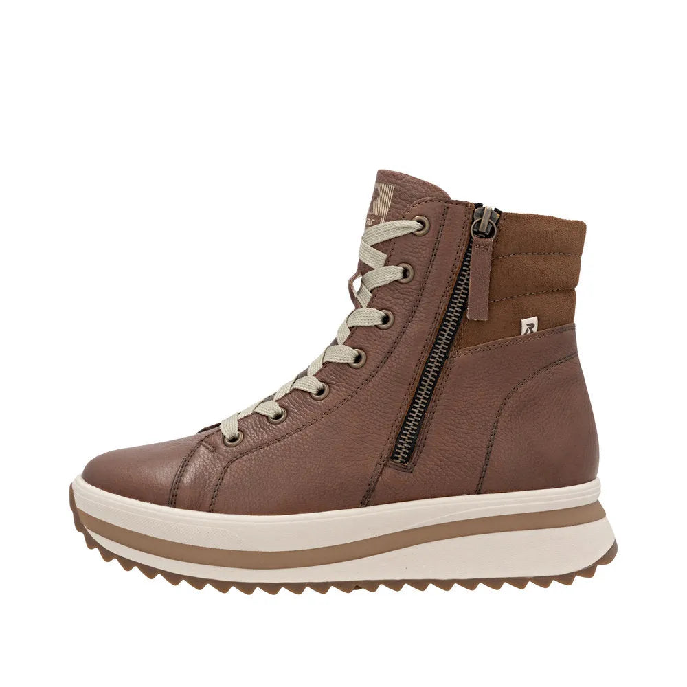 Rieker W3870-24 ladies brown leather ankle boots with zip and lace-up closure, cushioned sole, and rugged rubber outsole.