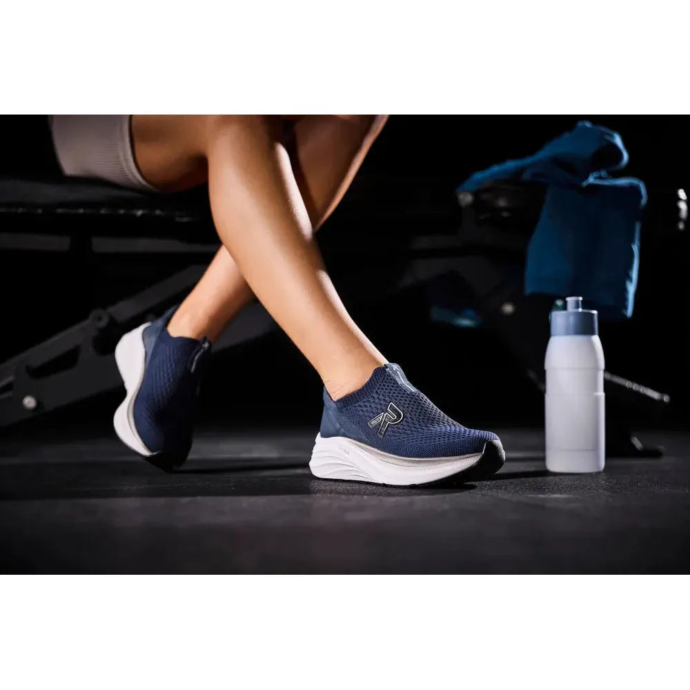 Rieker W4100-14 blue textile ladies' elasticated trainers on a woman at gym with water bottle, fitness footwear, casual athletic shoes.