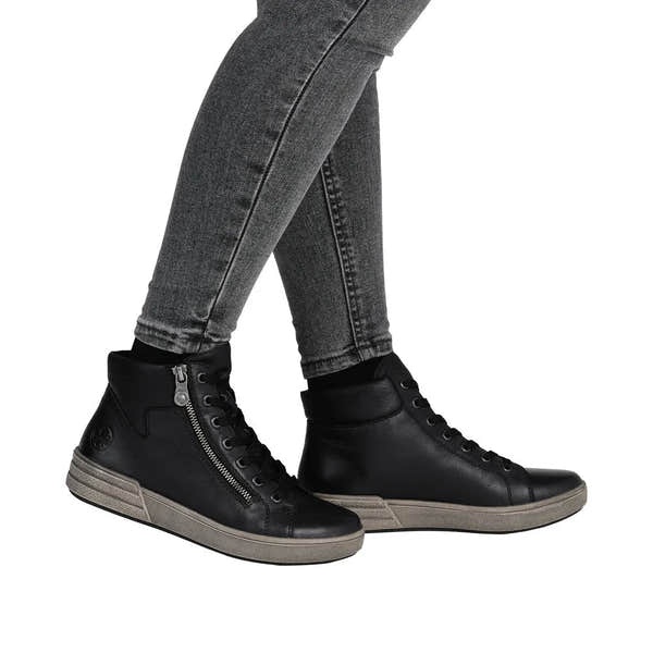 Women's black leather ankle boots with zip and lace-up detail, stylish and comfortable footwear.