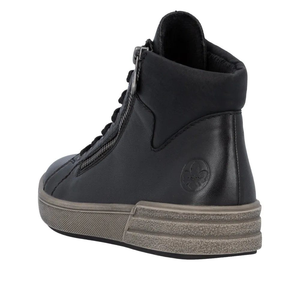 Rieker X0709-01 women's black leather ankle boots with zip and lace-up detail, padded collar, and rugged sole.