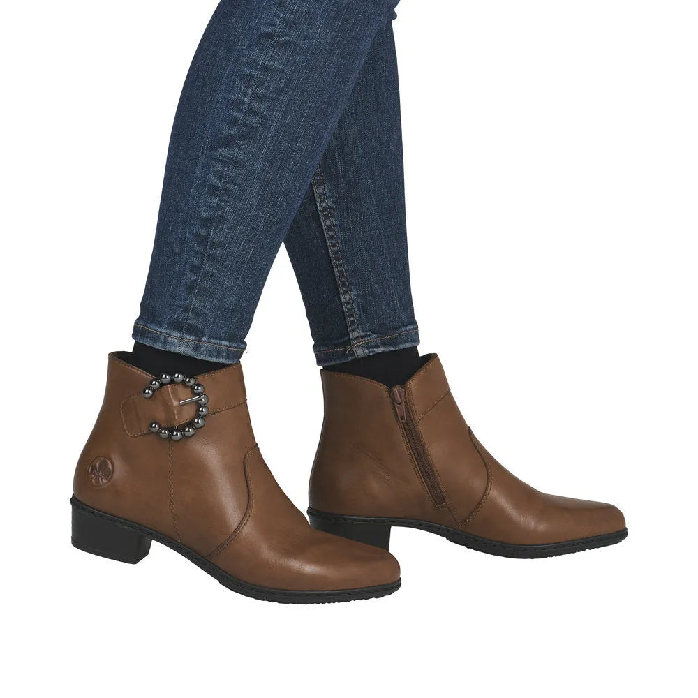 Rieker Y0797-24 women's brown leather ankle boots with side zipper and decorative buckle, low heel, stylish and comfortable footwear.