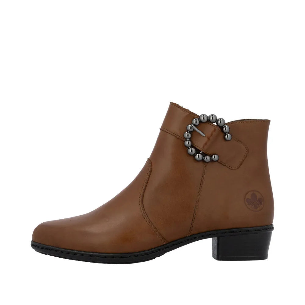 Rieker Y0797-24 women's brown leather ankle boots with side zip and decorative buckle detail.