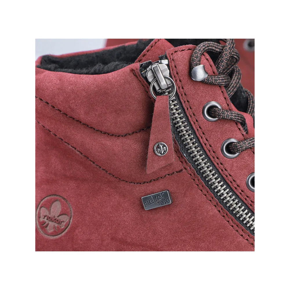 Rieker Y6104-35 women's red water-resistant ankle boots with zip, lace-up front, and black fleece lining.