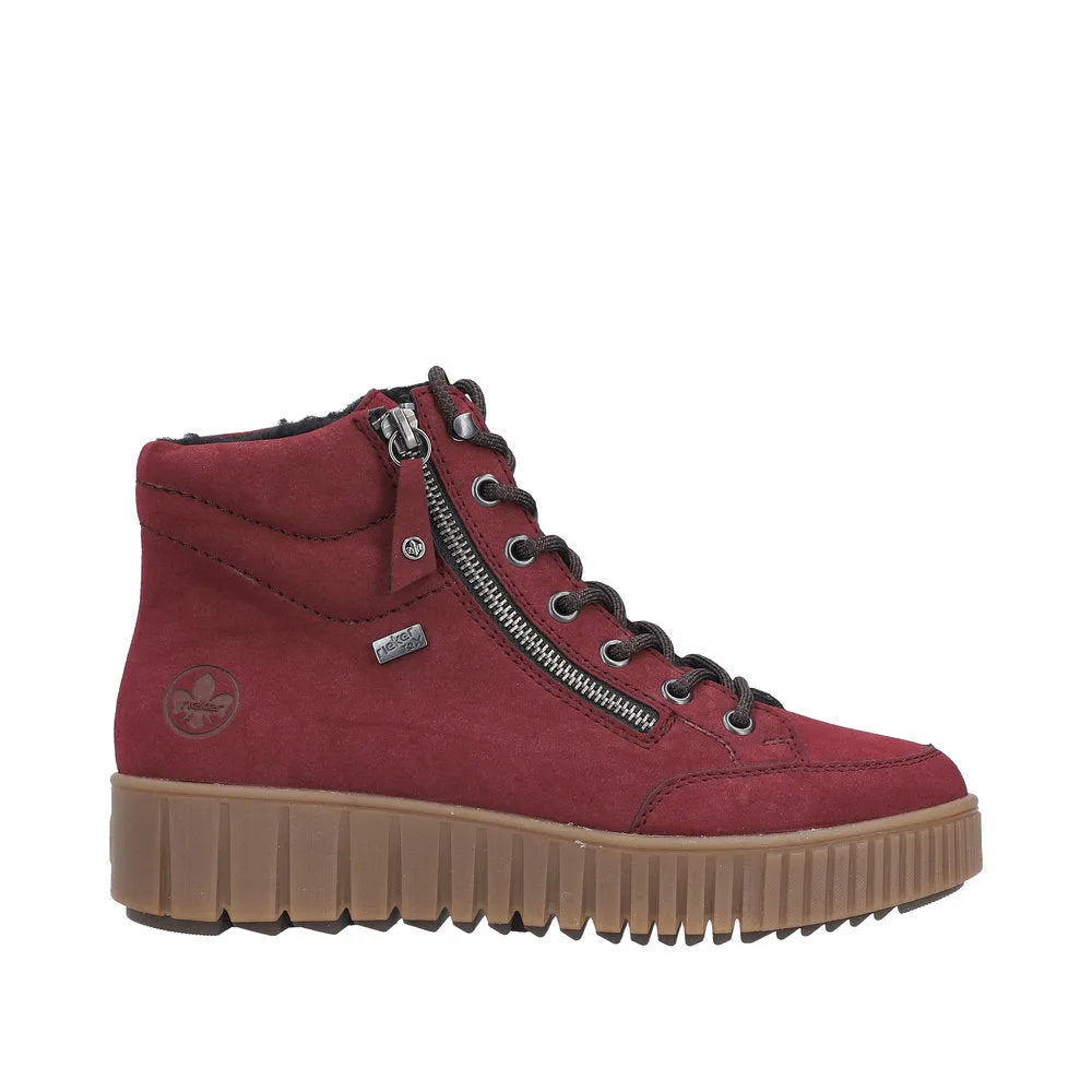 Rieker Y6104-35 women's red water-resistant ankle boots with lace-up and zip closure, chunky rubber sole, and logo details.