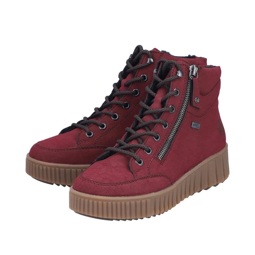 Rieker Y6104-35 ladies red water-resistant ankle boots with zip and lace-up closure, black laces, and beige chunky sole.