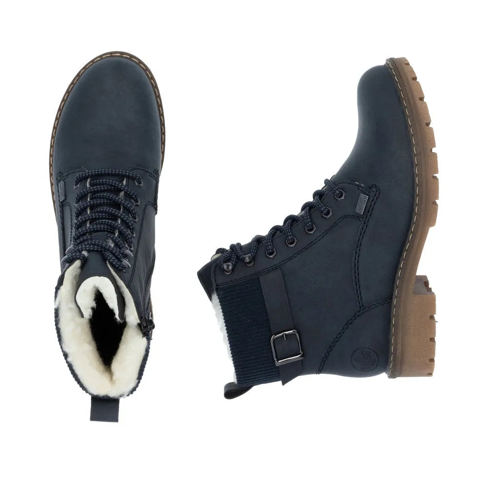 Rieker Y9102-14 women's blue water-resistant ankle boots with lace-up and zipper, plush lining, rugged sole, and ankle strap detail.