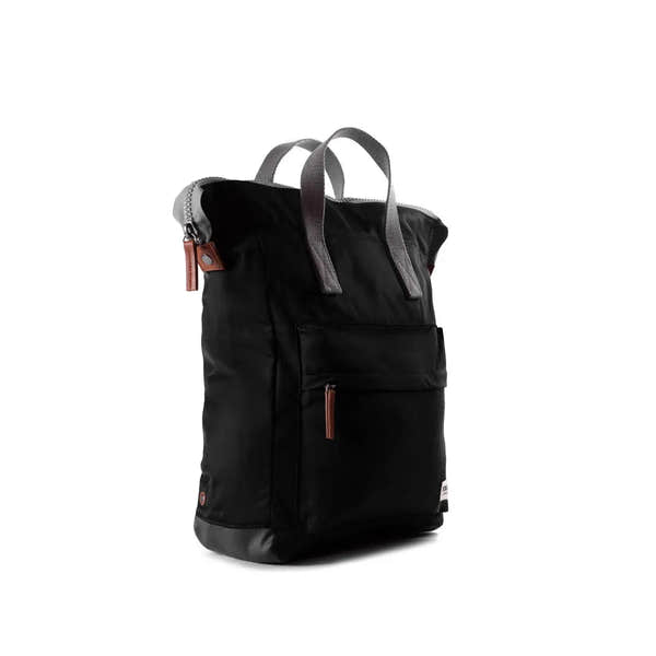 Roka Bantry B Black recycled nylon backpack with front pocket and gray handles, eco-friendly and durable design.