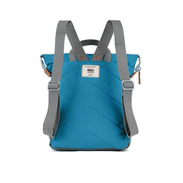 Roka Bantry B Marine recycled nylon backpack in vibrant blue with gray adjustable straps and a front logo patch.